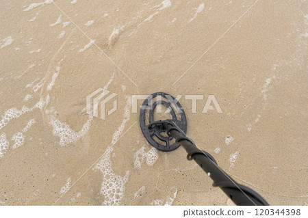 Metal Detector Search Coil Scanning Beach Sand, Treasure Hunt, Lost Jewels, Copy Space for Text Metal Detector Search Coil Scanning Beach Sand, Treasure Hunt, Lost Jewels, Copy Space for Text 120344398