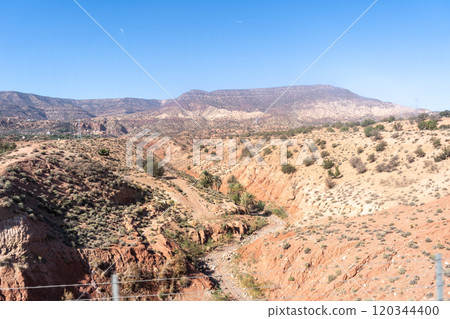 Morocco semi-deserts and mountains, north africa nature, Moroccan stone desert, red hills, villages and argan trees 120344400