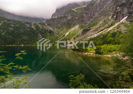 Alpine lake landscape, Morskie Oko or Sea Eye in high Tatras mountain of Tatra national park, Poland 120344404