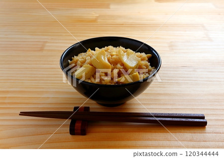 Bamboo shoot rice served in a black bowl Bamboo shoot rice served in a black bowl 120344444