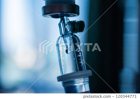 Close up medical intravenous IV drip in hospital background 120344771