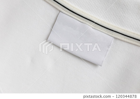 Blank white laundry care clothes label on white shirt fabric texture background Blank white laundry care clothes label on white shirt fabric texture background 120344878
