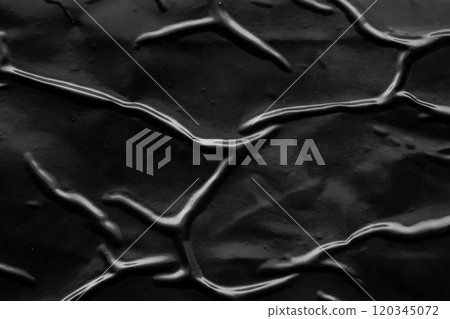 black crumpled and creased plastic poster texture background 120345072