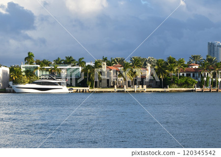 Luxury houses at the canal in Miami Beach. Elegant waterfront mansions line the picturesque canals of Miami Beach Luxury houses at the canal in Miami Beach. Elegant waterfront mansions line the picturesque canals of Miami Beach 120345542