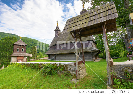 likitsary, transcarpathia, ukraine - jul 02, 2020: st. vasyl wooden church in carpathian mountains. amazing architecture landmark. sunny summer day likitsary, transcarpathia, ukraine - jul 02, 2020: st. vasyl wooden church in carpathian mountains. amazing architecture landmark. sunny summer day 120345862