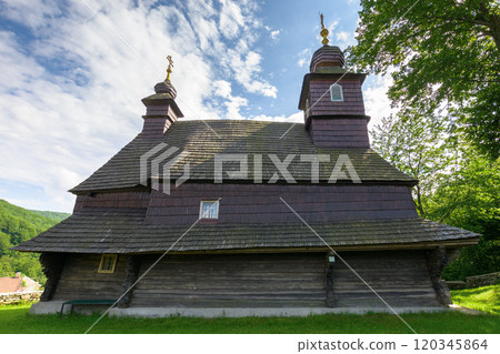 likitsary, transcarpathia, ukraine - jul 02, 2020: st. vasyl wooden church in carpathian mountains. religious sightseeing. sunny summer day. hope in god likitsary, transcarpathia, ukraine - jul 02, 2020: st. vasyl wooden church in carpathian mountains. religious sightseeing. sunny summer day. hope in god 120345864