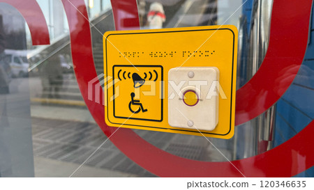 Sign for disabled person and help button in front of metro entrance Sign for disabled person and help button in front of metro entrance 120346635