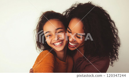 Portrait of a smiling mother and teenage daughter for family lifestyle imagery 120347244