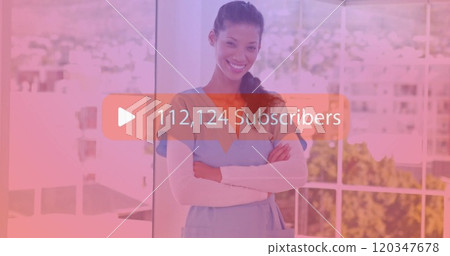 Smiling nurse in scrubs with 228,107 Subscribers image over her Smiling nurse in scrubs with 228,107 Subscribers image over her 120347678