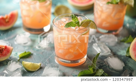 freshly squeezed orange juice in a glass on the table with citrus fruits 120347997