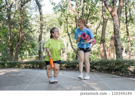Empowering Friendship Disabled Young Woman Jogging with Close Friend in Park, Embracing Fitness and Togetherness Empowering Friendship Disabled Young Woman Jogging with Close Friend in Park, Embracing Fitness and Togetherness 120349140
