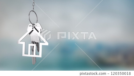 House-shaped keychain image over blurred background 120350018