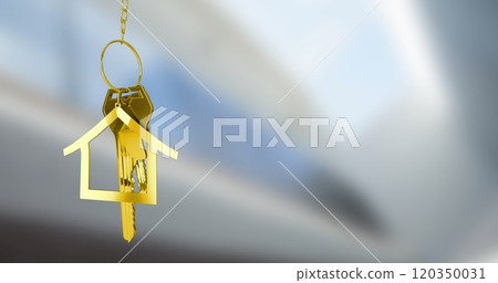 Golden house keychain image over blurred background 120350031