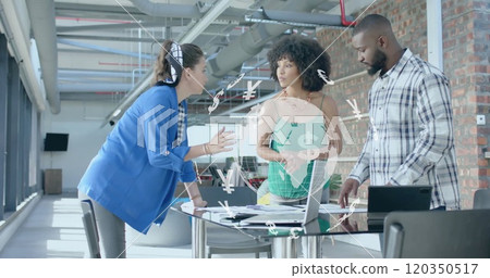Image of currency icons and data processing over diverse business people in office Image of currency icons and data processing over diverse business people in office 120350517