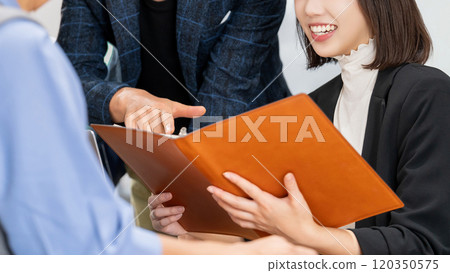 Three businessmen having a meeting 120350575