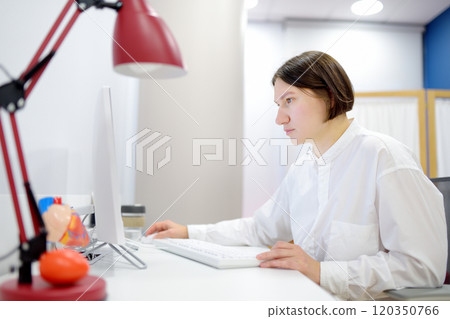 A cardiologist in medical office during appointment of patient A cardiologist in medical office during appointment of patient 120350766