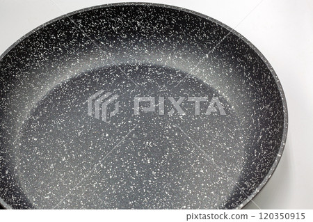 New frying pan closeup on white. 120350915