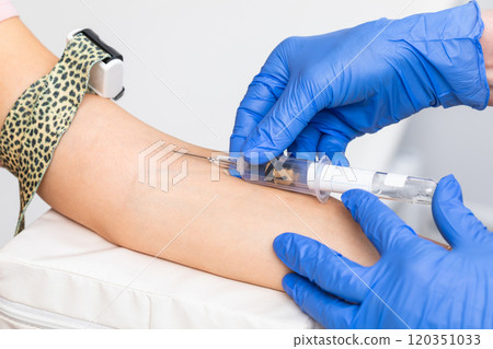 Healthcare Professional Performing Blood Draw 120351033