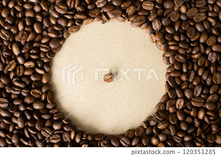 One bean of coffee in copy space shape of circle and surrounded by many beans One bean of coffee in copy space shape of circle and surrounded by many beans 120351285
