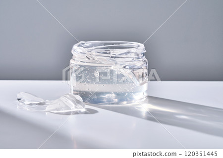Texture of the gel in the jar. Hair gel or hyaluronic gel for the face. Texture of the gel in the jar. Hair gel or hyaluronic gel for the face. 120351445