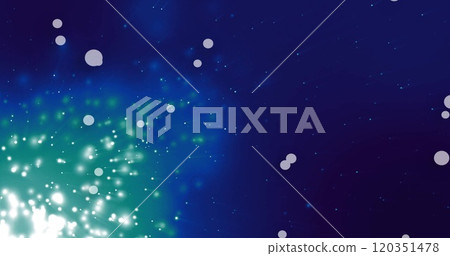 Glowing particles and light bursts image over dark blue background 120351478