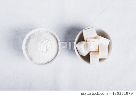 Choosing between granulated sugar and refined sugar in bowls on white background 120351979