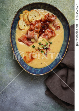 Pumpkin cream soup, curry, fried bacon, bruschetta chips,micro-greens, top view, no people, Pumpkin cream soup, curry, fried bacon, bruschetta chips,micro-greens, top view, no people, 120352876