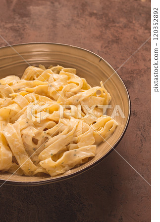 Fettuccine, tagliatelle, in creamy garlic sauce, Italian traditional cuisine, pasta carbonaro, 120352892