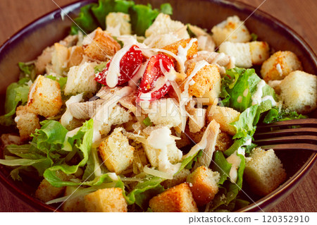 classic Caesar salad, close-up, natural light, selective focus, horizontal, 120352910