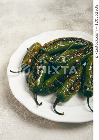 fried padron pepper, in a frying pan, with olive oil, and sea salt, homemade, no people. 120352938