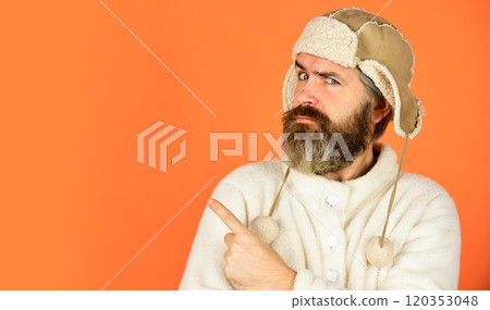 Barber services. Bearded man wear hat with ear flaps. Furry accessory. Fur garments. Bearded hipster. Winter fashion. Warm hat for cold weather. Beard care for winter season. Facial hair concept 120353048