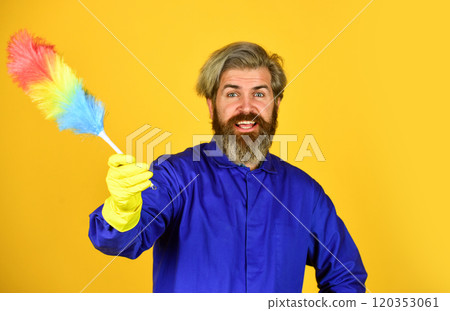 Husband cleaning home. Polypropylene duster. Hipster hold cleaning tool. Cleaning concept. Small duster. Cleaning service. Housekeeping duties. Cleaning apartment. Man use pp duster. Dust allergy Husband cleaning home. Polypropylene duster. Hipster hold cleaning tool. Cleaning concept. Small duster. Cleaning service. Housekeeping duties. Cleaning apartment. Man use pp duster. Dust allergy 120353061