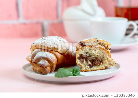 Breakfast with tea and croissant cookies or crookie. 120353340