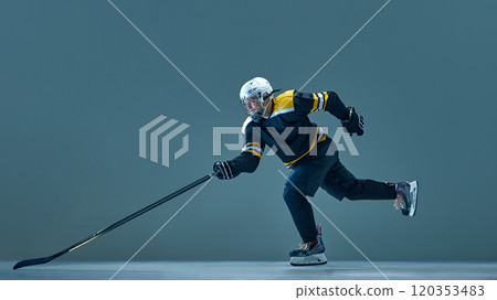 Dynamic image of man, professional ice hockey player in motion, wearing helmet and uniform, training before the game Dynamic image of man, professional ice hockey player in motion, wearing helmet and uniform, training before the game 120353483