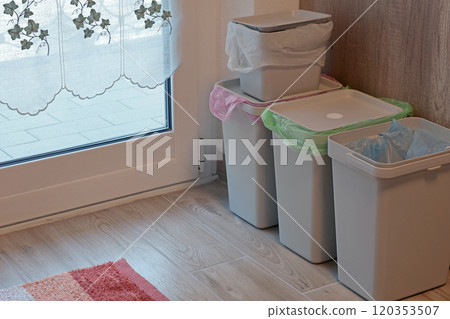 Separate sorting of garbage at home. Colorful bags and containers. Ecology and safe waste. Separate sorting of garbage at home. Colorful bags and containers. Ecology and safe waste. 120353507