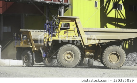 A Heavy Duty Dump Truck Handling Bulk Materials at a Busy Construction Site Environment. Stock Clip A Heavy Duty Dump Truck Handling Bulk Materials at a Busy Construction Site Environment. Stock Clip 120355059
