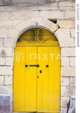 Traditional door, vibrant yellow. Malta 120355175