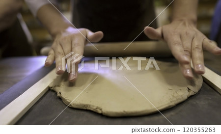 Hands Skillfully Working with Clay during an Engaging Pottery Class Experience in a Studio. Stock Clip Hands Skillfully Working with Clay during an Engaging Pottery Class Experience in a Studio. Stock Clip 120355263