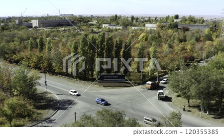 A breathtaking autumn view showcasing a roundabout embraced by vibrant and colorful trees. Stock Clip 120355385
