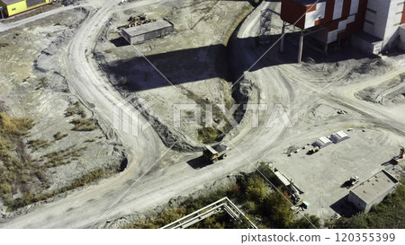 An aerial view reveals an expansive industrial site with diverse machinery and structures. Stock Clip An aerial view reveals an expansive industrial site with diverse machinery and structures. Stock Clip 120355399