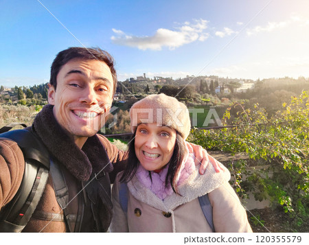 Couple in love smiling on vacation in Tuscany Couple in love smiling on vacation in Tuscany 120355579