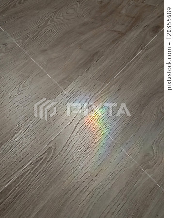 Rainbow spot on the floor, laminate, refraction of light Rainbow spot on the floor, laminate, refraction of light 120355689