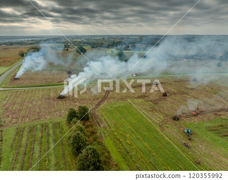 FRANCE, GIRONDE, NAUJAN-ET-POSTIAC, BORDEAUX VINEYARD UPROOTING CAMPAIGN WITH BACKHOE LOADER 120355992