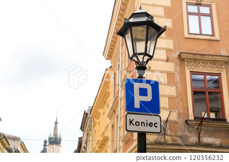 The lamppost with the parking sign ends here on the old streets of Europe. 120356232