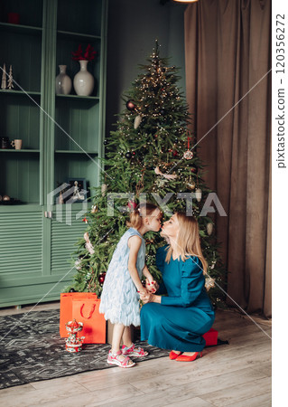 Little girl and her mom on Christmas morning at Little girl and her mom on Christmas morning at 120356272
