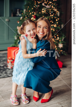 Daughter hugging mummy so tight 120356285