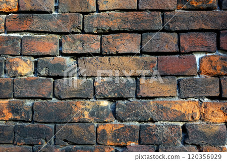 Ancient medieval brick wall, red-black colored brickwork 120356929