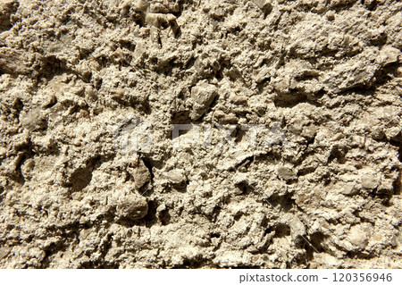 Textured Plaster Wall Background Featuring a Rough, Natural Finish Commonly Used in Interior Spaces 120356946