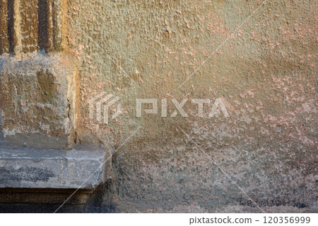 Corner of a window with cement edging and peeling wall with green and carmine stains Corner of a window with cement edging and peeling wall with green and carmine stains 120356999