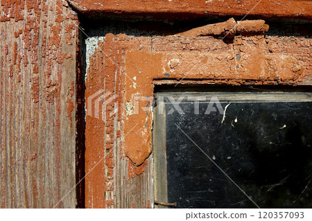 Close-up of Old Painted Wooden Window Revealing Weathered Textures and Glass Details in Rustic Home 120357093
